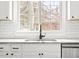 Kitchen sink featuring granite countertops, stainless steel appliances, and large window with backyard views at 1621 Nottingham Dr, Indianapolis, IN 46240