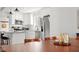 Modern kitchen with stainless steel appliances, granite countertops, and a view into the dining area at 1621 Nottingham Dr, Indianapolis, IN 46240