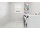 Efficient laundry room with modern washer and dryer, offering convenience and functionality at 1621 Nottingham Dr, Indianapolis, IN 46240