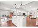 Open living space featuring a kitchen island, dining area, and living room at 1621 Nottingham Dr, Indianapolis, IN 46240
