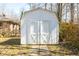 Well-maintained white wooden shed offering extra storage and utility in the backyard at 1621 Nottingham Dr, Indianapolis, IN 46240