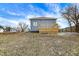 Wide backyard view includes deck, yard and a glimpse of neighboring homes at 1842 Tallman Ave, Indianapolis, IN 46218