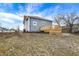 Side view of home featuring a new wooden deck, siding, and crisp white windows at 1842 Tallman Ave, Indianapolis, IN 46218