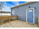 Backyard features a deck with wooden railing and the back door of home at 1842 Tallman Ave, Indianapolis, IN 46218