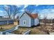 Exterior home elevation featuring new siding, windows, and trim at 1842 Tallman Ave, Indianapolis, IN 46218