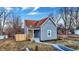 Charming home featuring a new fence, porch, and light blue paint at 1842 Tallman Ave, Indianapolis, IN 46218