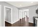 Open floor plan with grey paint throughout and featuring a kitchen with stainless steel appliances at 1842 Tallman Ave, Indianapolis, IN 46218