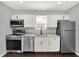 This is a recently updated kitchen with stainless steel appliances and lots of natural light at 1842 Tallman Ave, Indianapolis, IN 46218