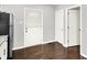 View of the kitchen with stainless steel refrigerator and granite countertops at 1842 Tallman Ave, Indianapolis, IN 46218