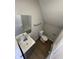 Bathroom featuring vinyl flooring, single sink vanity, mirror, and standard toilet at 2133 Webb St, Indianapolis, IN 46225