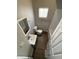 Bathroom with a single sink vanity, wood-look floors, window and a toilet near the shower at 2133 Webb St, Indianapolis, IN 46225
