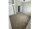 Cozy bedroom featuring plush carpeting, neutral walls and a large closet with bi-fold doors at 2133 Webb St, Indianapolis, IN 46225