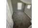 Sloped ceiling bedroom with two bright windows and neutral carpeting at 2133 Webb St, Indianapolis, IN 46225