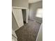 Bedroom showcasing plush carpeting, a double-door closet, and bright windows with white blinds at 2133 Webb St, Indianapolis, IN 46225