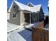 Cozy home with covered porch and snow-covered yard at 2133 Webb St, Indianapolis, IN 46225