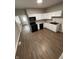 Open kitchen features white cabinets, black appliances, and modern floors at 2133 Webb St, Indianapolis, IN 46225