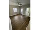 Living room with hardwood floors, a ceiling fan, and bright natural light at 2133 Webb St, Indianapolis, IN 46225