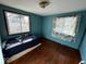 Simple bedroom with hardwood floors, a window letting in natural light, and a cozy atmosphere at 2503 S Lyons Ave, Indianapolis, IN 46241