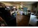 View of a kitchen featuring appliances, hardwood floors, and an open doorway at 2503 S Lyons Ave, Indianapolis, IN 46241