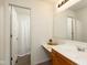Cozy bathroom with single sink vanity and tiled shower at 3038 Wildcat Ln, Indianapolis, IN 46203