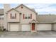 Charming two-story townhome with three car garage and red shutters at 3038 Wildcat Ln, Indianapolis, IN 46203