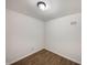 An empty room featuring wood-look floors, neutral wall paint, a ceiling light, and minimal decor at 310 Hickory Dr, Greenfield, IN 46140