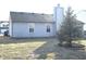 View of the rear of a home featuring a mature tree at 400 Lockerbie Ln, Pittsboro, IN 46167