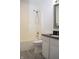 The bathroom features a shower over bath, with a vanity and a well-lit mirror at 400 Lockerbie Ln, Pittsboro, IN 46167