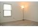 The bedroom is bright with a window and features vinyl floors at 400 Lockerbie Ln, Pittsboro, IN 46167