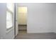 An bedroom boasts a well-lit walk-in closet, providing ample storage space at 400 Lockerbie Ln, Pittsboro, IN 46167