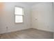 A bright bedroom with a window and fresh white paint at 400 Lockerbie Ln, Pittsboro, IN 46167