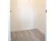 Walk-in closet showing ample storage space with neutral walls and wood flooring at 400 Lockerbie Ln, Pittsboro, IN 46167