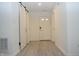 Hallway featuring light grey laminate flooring and white painted walls at 400 Lockerbie Ln, Pittsboro, IN 46167