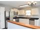Bright kitchen featuring stainless steel appliances and white cabinetry at 400 Lockerbie Ln, Pittsboro, IN 46167