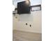 A clean laundry area provides additional storage with cabinets and includes washer and dryer hookups at 400 Lockerbie Ln, Pittsboro, IN 46167