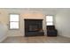 Cozy living room featuring a black fireplace and natural light at 400 Lockerbie Ln, Pittsboro, IN 46167