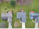An aerial view showing a home with a wooden deck, surrounded by a green lawn and neighboring houses at 4019 Santa Clara Dr, Greenwood, IN 46142