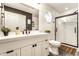Modern bathroom featuring a white vanity, matte black fixtures, and a glass-enclosed shower at 4019 Santa Clara Dr, Greenwood, IN 46142