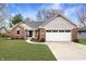 Beautiful single-Gathering home featuring a brick facade, two-car garage, and well-manicured lawn at 4019 Santa Clara Dr, Greenwood, IN 46142