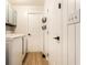 Neat laundry room featuring a modern washer, contrasting hardware, and ample storage space at 4019 Santa Clara Dr, Greenwood, IN 46142