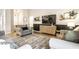 Inviting living room boasts a large, plush armchair, decorative accents, and a mounted flat-screen television at 4019 Santa Clara Dr, Greenwood, IN 46142