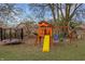Backyard featuring a wooden playset with a swing set and a trampoline for outdoor fun at 4019 Santa Clara Dr, Greenwood, IN 46142