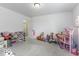 Spacious carpeted bedroom filled with toys and storage, featuring natural light at 4078 Omaha Dr, Bargersville, IN 46106
