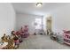 Spacious carpeted bedroom filled with toys, featuring natural light and a closet at 4078 Omaha Dr, Bargersville, IN 46106