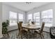 Bright dining area with natural light, wood table set, and a view of the outdoors at 4078 Omaha Dr, Bargersville, IN 46106