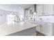 Bright, modern kitchen featuring white cabinets, quartz countertops, stainless steel appliances and spacious island at 4078 Omaha Dr, Bargersville, IN 46106