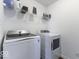 Clean, modern laundry room featuring a new front-loading washer and dryer set at 4078 Omaha Dr, Bargersville, IN 46106
