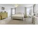 Bright main bedroom features carpeted floors, dresser, desk and soft, natural light at 4078 Omaha Dr, Bargersville, IN 46106