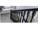 Modern staircase with dark wood railings and bright natural light from a window at 4078 Omaha Dr, Bargersville, IN 46106