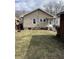 Spacious backyard featuring a lawn and exterior view of the house at 410 N Euclid Ave, Indianapolis, IN 46201
